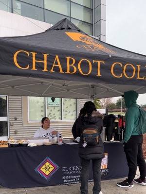 students at a welcome booth
